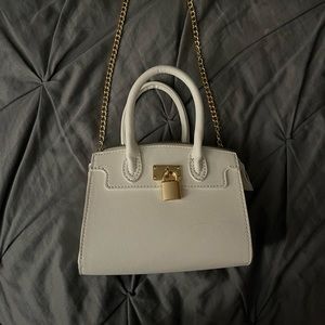 I am selling a leather white mini purse.